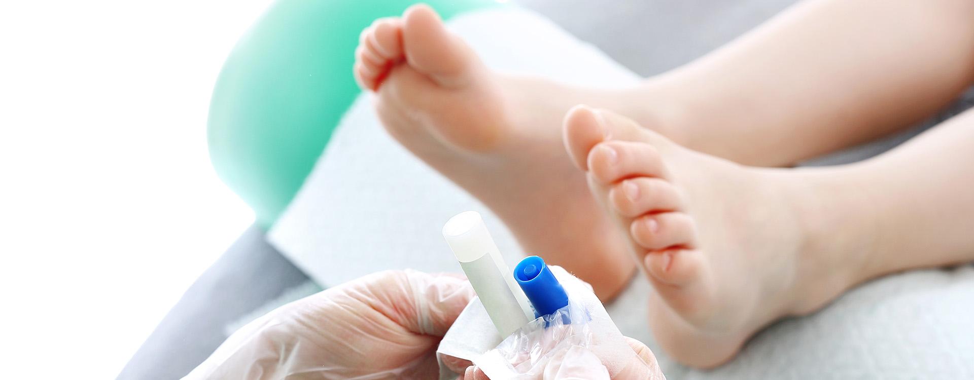 Podiatrist examining child's feet